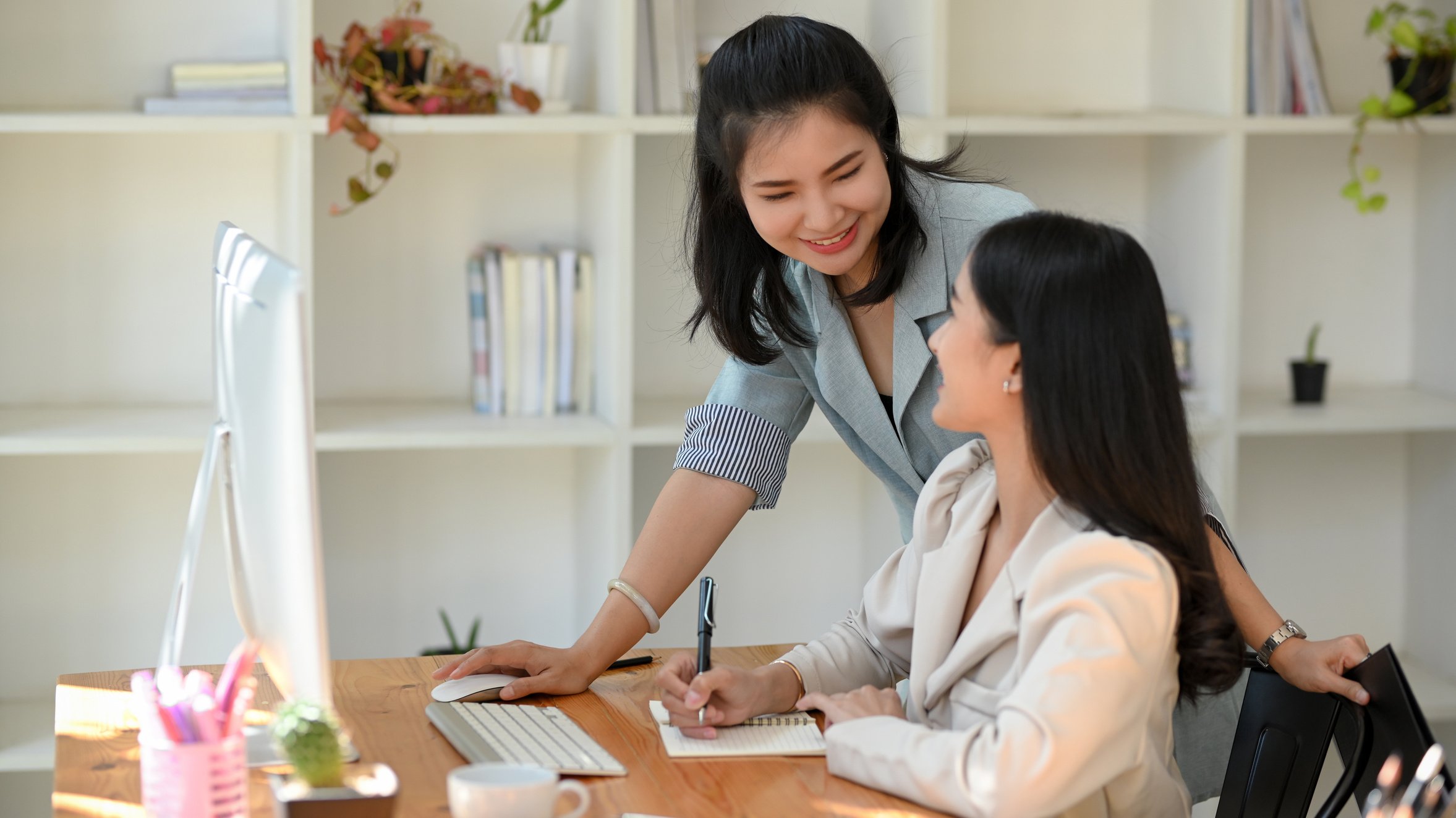 Female Manager Giving a Kindly Advise to Her Assistant